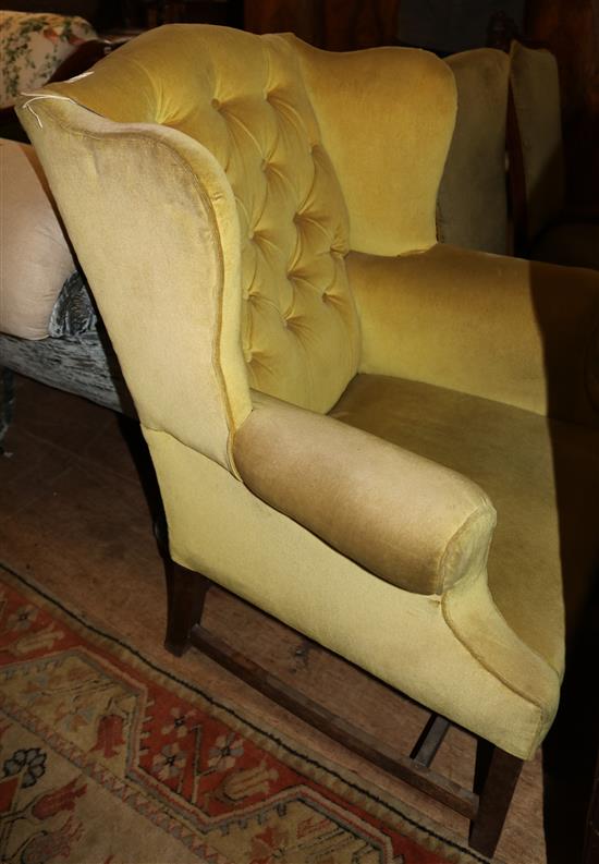Yellow upholstered wing back armchair
